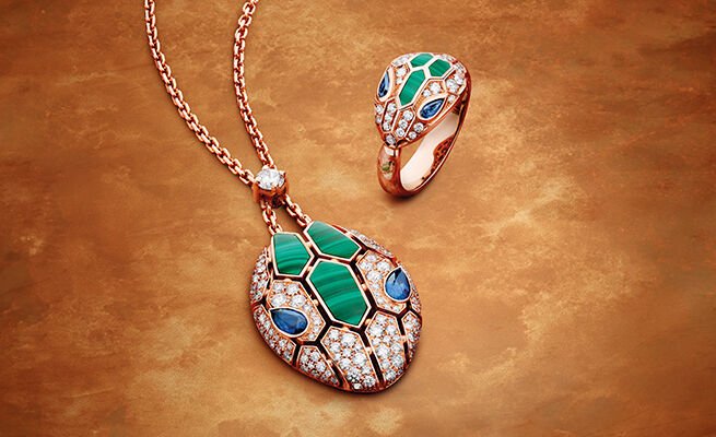 Serpenti bracelet and ring in white gold and full diamonds, both set with emerald eyes. Serpenti bracelet and ring in white gold and full diamonds, both set with emerald eyes.