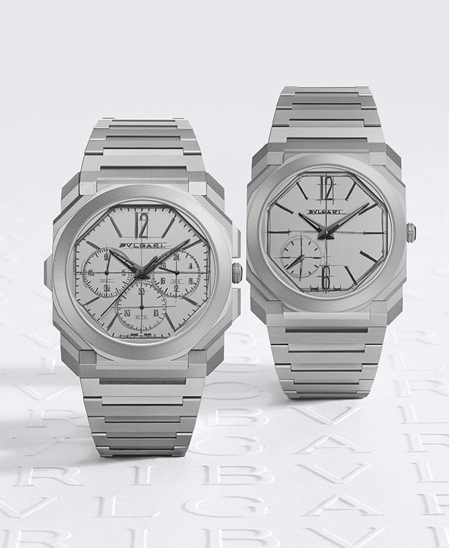 Octo Finissimo Chronograph GMT und Octo Finissimo Automatic, die Uhren zum 10. Jubiläum, Hintergrund mit Logo. Octo Finissimo Chronograph GMT und Octo Finissimo Automatic, die Uhren zum 10. Jubiläum, Hintergrund mit Logo.