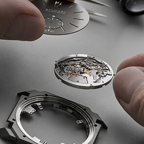 Watchmaker assembling the components of the Octo Finissimo Minute Repeater watch calibre, close-up.
