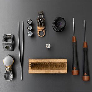 Bulgari's craftsmen tool kit from the tweezer to the magnifying glass, placed around a diamond.