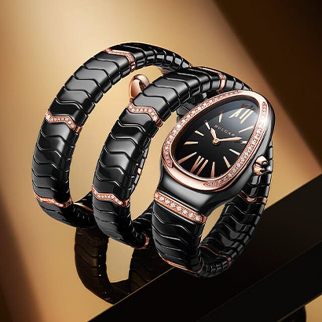 Serpenti Spiga double-coil watch in black ceramic with rose gold and diamond elements, and black dial.