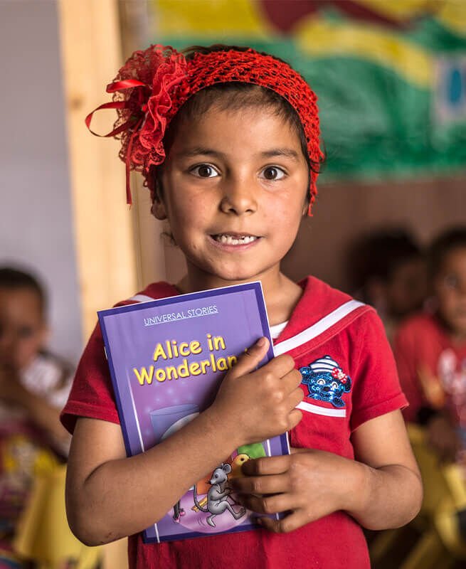 B-for-Beirut and Save the Children. Little girl with a book in her hands. B-for-Beirut and Save the Children. Little girl with a book in her hands.