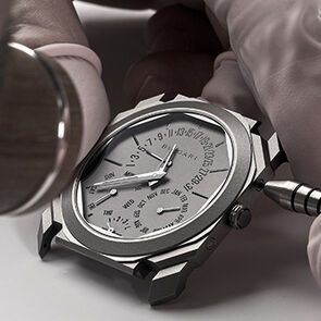 Watchmaker assembling the case of the Octo Finissimo Perpetual Calendar watch, close-up.
