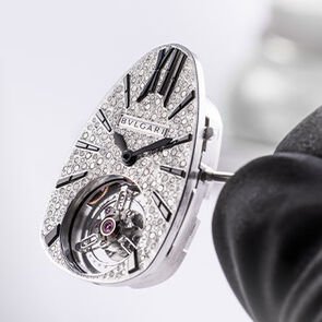Diamond-set dial of the Serpenti Seduttori Tourbillon white gold watch during the making of, close up.