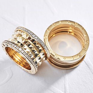 Two Bzero1 rings in yellow gold with diamonds.