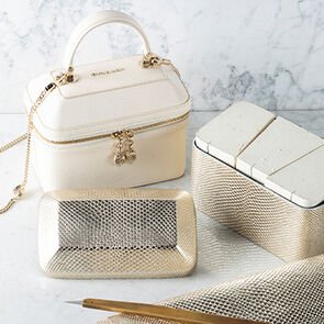 Parts in gold molten karung skin to be assembled and Serpenti Jewellery box in white calf leather.