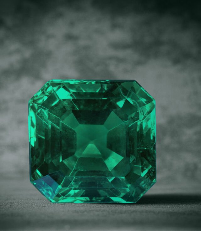 Large emerald-cut Bvlgari emerald, close-up shot.
