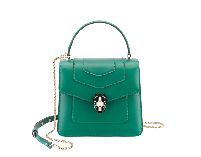 Serpenti Forever small top handle bag in emerald green calf leather with amethyst purple grosgrain lining.