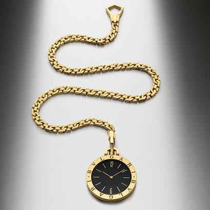 BULGARI pocket watch with gold case, black dial and gold chain 1989