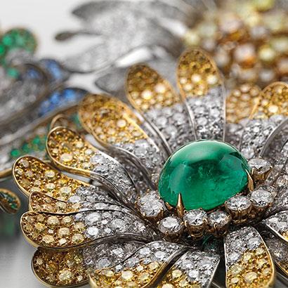 Bulgari Jewelry Daisy brooch in platinum with emerald, colourless and fancy yellow diamonds, 1969 Bulgari Jewelry Daisy brooch in platinum with emerald, colourless and fancy yellow diamonds, 1969