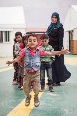 Kids with teacher from the Za' Atari refugee camp 