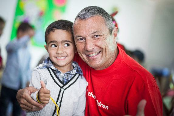 Jean-Christophe Babin and a boy for the education program with Save the Children